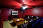 Basement Level Media Room Features a Large Leather Sectional, and 65 4K Smart TV